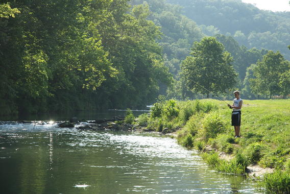 Person fishing in a river